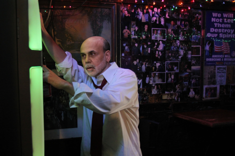 A drunken Bernanke attempts to find the Aerosmith song "Back In The Saddle" on the bar jukebox.